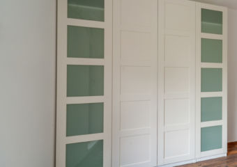 Beautiful modern house, empty room with white wardrobe (closet), wooden floor